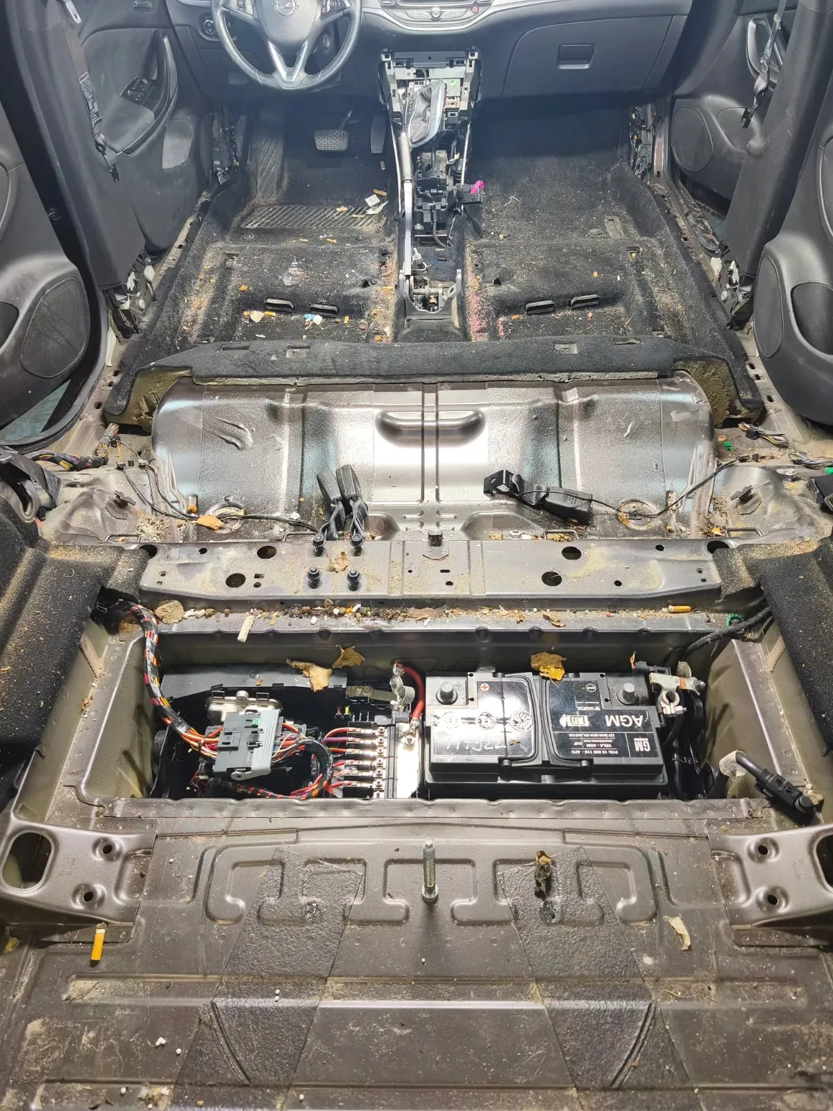 Opel Astra interior with the seats removed before cleaning